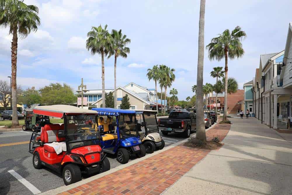 The,Villages,,Florida:,Three,Colorful,Golf,Carts,Parked,In,Front